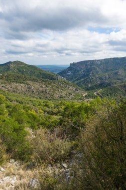 View on the outside of the Cirque de l'Infernet and the plain of Languedoc from the slopes of Mont Saint-Baudille