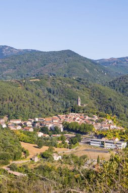 Sunny view of the medieval village of Olargues and the surrounding mountains of the Haut-Languedoc Regional Natural Park