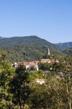 Sunny view of the medieval village of Olargues and the surrounding mountains of the Haut-Languedoc Regional Natural Park