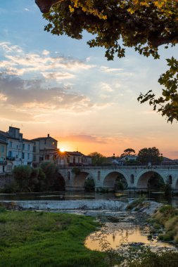 Sunset on the Roman bridge crossing the Vidourle in Sommieres