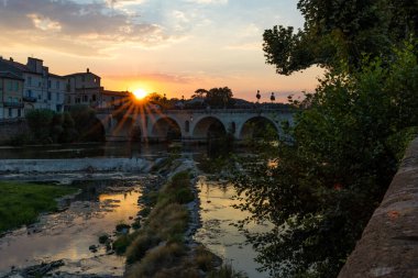 Sunset on the Roman bridge crossing the Vidourle in Sommieres