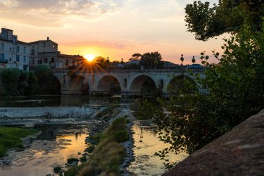 Sunset on the Roman bridge crossing the Vidourle in Sommieres