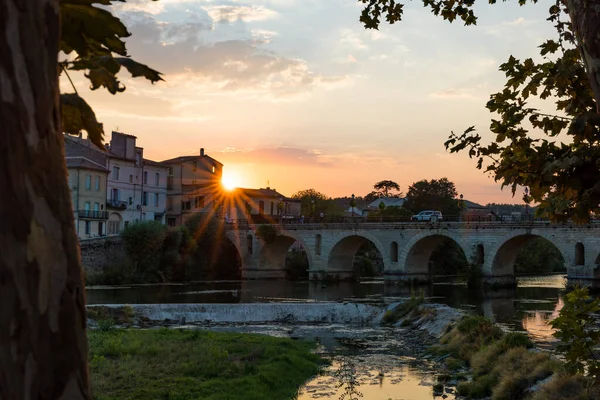 Sunset on the Roman bridge crossing the Vidourle in Sommieres