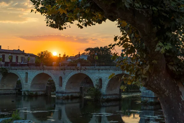 Sunset on the Roman bridge crossing the Vidourle in Sommieres