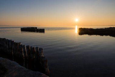 Sun setting over Etang de l'Or from Pointe du Salaison
