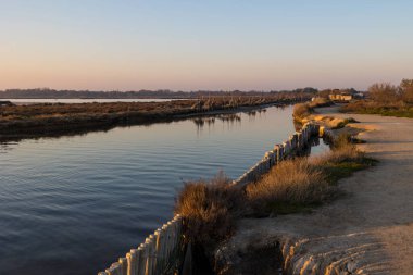 Salaison river joining the Etang de l'Or at sunset