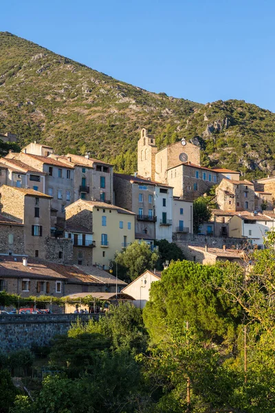 Stock image View at the end of the day of the medieval village of Roquebrun at the edge of the Orb in the Regional Natural Park of the Haut-Languedoc