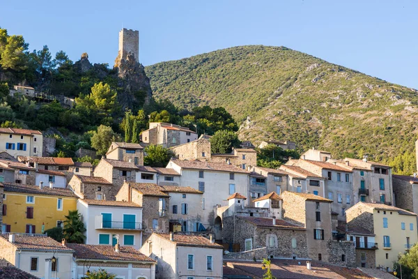 Stock image View at the end of the day of the medieval village of Roquebrun at the edge of the Orb in the Regional Natural Park of the Haut-Languedoc