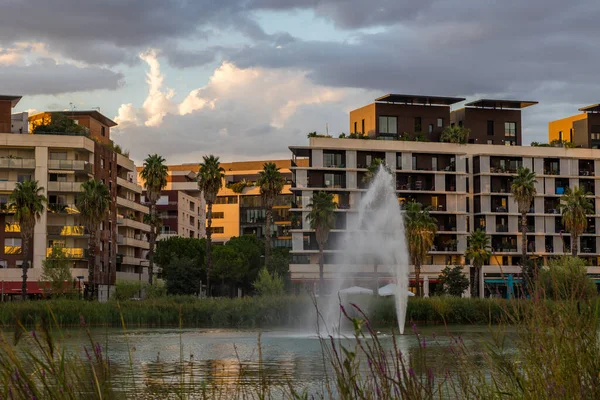 stock image Residential buildings around Bassin Jacques Coeur in Montpellier illuminated by sunset