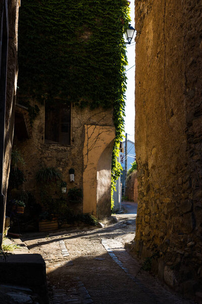 Alley of the Hamlet of Ceps in Roquebrun under a summer sun