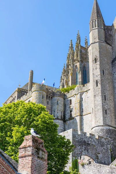 Stock image View from below on the Abbey of Mont Saint-Michel and its bell tower topped by the Archangel Saint-Michel