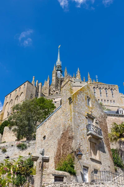 Stock image View from below on the Abbey of Mont Saint-Michel and its bell tower topped by the Archangel Saint-Michel