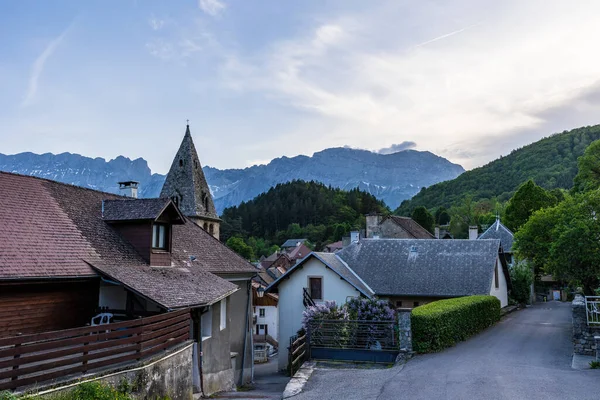 stock image Bell tower of the Church of Saint-Firmin, in the Valgaudemar Valley, at sunset