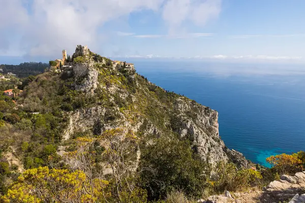 stock image Perched village of Eze on its rocky peak and its exotic garden overlooking the Mediterranean Sea