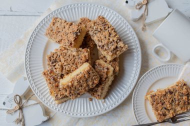 Nut cake with hazelnuts with easter decoration on white background. Flat lay