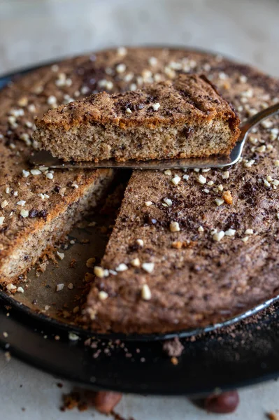 Gluten free cake with nuts, almonds and dark chocolate
