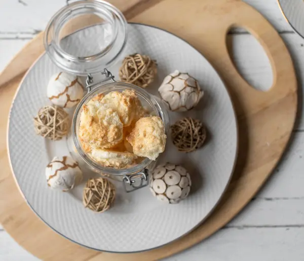 Easy and quick christmas cookie recipe with gluten free coconut macaroons on a white christmas plate with decoration.