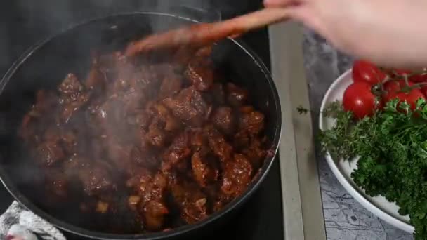 Beef Goulash Cooking Stove Getting Stirred Wooden Spoon Womans Hand — Stock Video