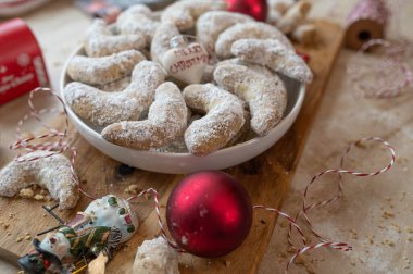 Christmas plate with fresh baked vanilla crescents with decoration clipart