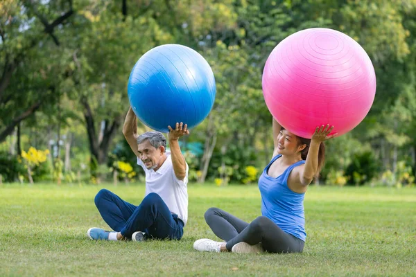 Senior Asian Man His Daughter Exercising Yoga Ball Public Park — Stock Photo, Image