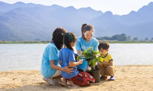 Team Volunteer Worker Group Teaching Children Planting Tree Charitable Social — Stock Photo, Image