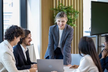 Caucasian woman sale manager is showing annual report chart to her colleagues in executive meeting for next year plan with market share increase for global business and investment clipart