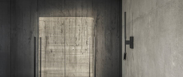 Современный минималистичный интерьер спальни в серых и черных тонах с глиняной текстурой стен в бетонном стиле