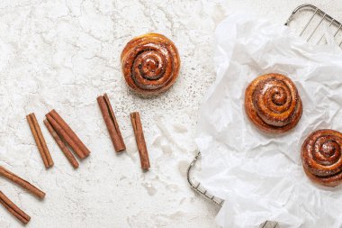 Freshly baked homemade Cinnamon rolls or Cinnamon buns on baking paper