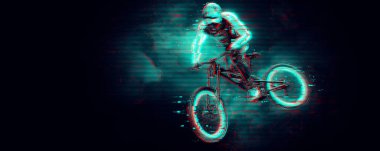 Abstract silhouette of a mtb rider, man is doing a trick, isolated on black background. Mountain cycling sport transport.