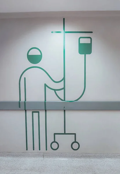 mural of a sick person on a hospital corridor wall
