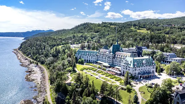 stock image Manoir Richelieu (Fairmont Hotel) in La Malbaie, Charlevoix, Quebec, Canada. Aerial view by drone. Built at the end of the 19th century in traditional French-chateau style.