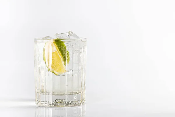 Gin Tonic Cocktail Deep Glass Garnished Lime Ice Isolated White — Stock Photo, Image