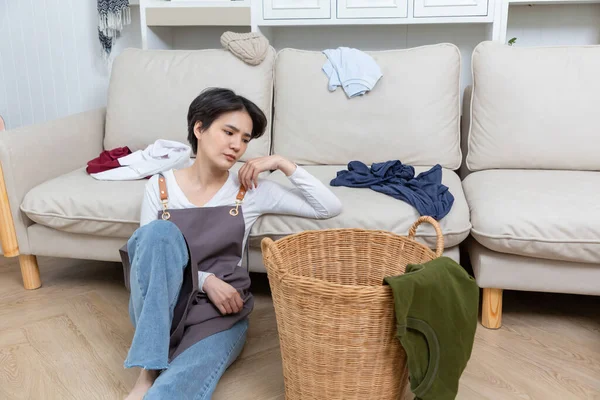 stock image Tired unhappy woman housewife in stress sitting in living room.