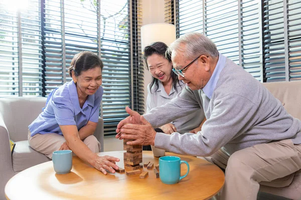 Elderly Friends Building Tower Wooden Cubes Leisure Time Nursing Home — Stock Photo, Image