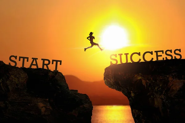 Athlete jumping on sunset sky at top of mountain and number like SUCCESS on sunset. Start to Success concept.