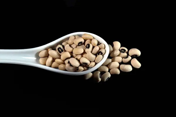 White Ceramic Spoon Full Beans Isolated Black Background — Stock Photo, Image