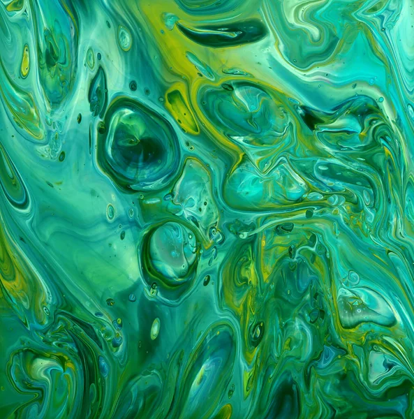 Teal green and yellow abstract fluid art background of acrylic paint, with marbling effect, colorful bubbles and copy space