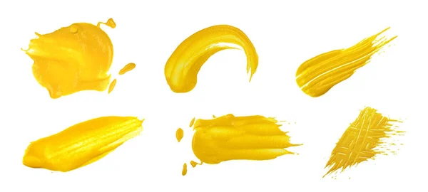 将不同的黄色芥末湿污渍集中在一起 白色背景 顶视图 正上方 — 图库照片
