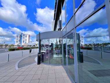 Reflection. Travel to Scandinavia during summer on holiday , Shopping center i Herning - Denmark clipart