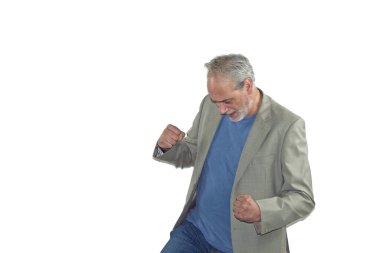mature man with beard and a suit dancing on a white background