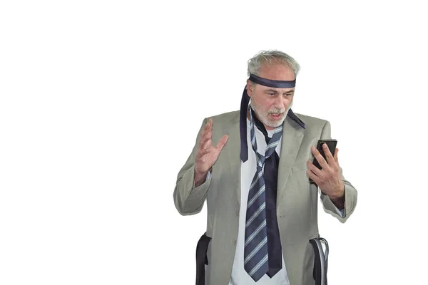 crazy mature man with beard in a suit and many ties standing on a white background
