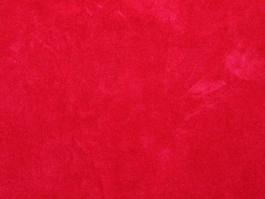 Arka plan olarak kırmızı kadife kumaş dokusu kullanılıyor. Yumuşak ve pürüzsüz tekstil malzemelerinden oluşan boş kırmızı kumaş arka plan. Metin için boşluk var.