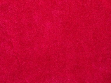Arka plan olarak kırmızı kadife kumaş dokusu kullanılıyor. Yumuşak ve pürüzsüz tekstil malzemelerinden oluşan boş kırmızı kumaş arka plan. Metin için boşluk var.