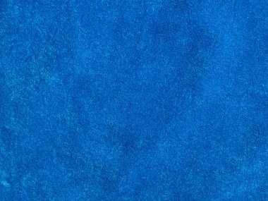 Arka plan olarak kullanılan açık mavi kadife kumaş dokusu. Yumuşak ve pürüzsüz tekstil malzemesinin boş açık mavi kumaş arkaplanı. 