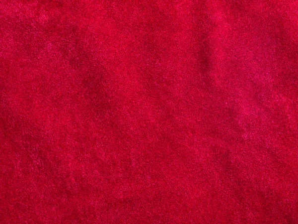 背景として使用される赤いベルベット生地のテクスチャ 柔らかく滑らかな繊維素材の空の赤い生地の背景 テキストのスペースがあります — ストック写真