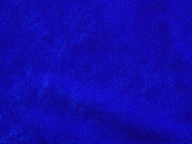 Blue velvet fabric texture used as background. Empty blue fabric background of soft and smooth textile material. There is space for text.	