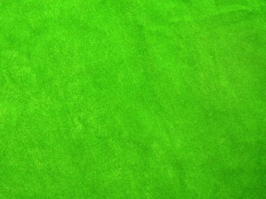 green velvet fabric texture used as background. Empty green fabric background of soft and smooth textile material. There is space for text..	