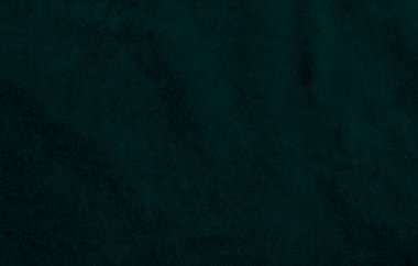Arka plan olarak kullanılan koyu yeşil kadife kumaş dokusu. Yumuşak ve pürüzsüz tekstil malzemelerinden oluşan boş yeşil kumaş arka planı. Metin için boşluk var.