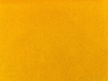 Yellow velvet fabric texture used as background. Empty yellow fabric background of soft and smooth textile material. There is space for text.	