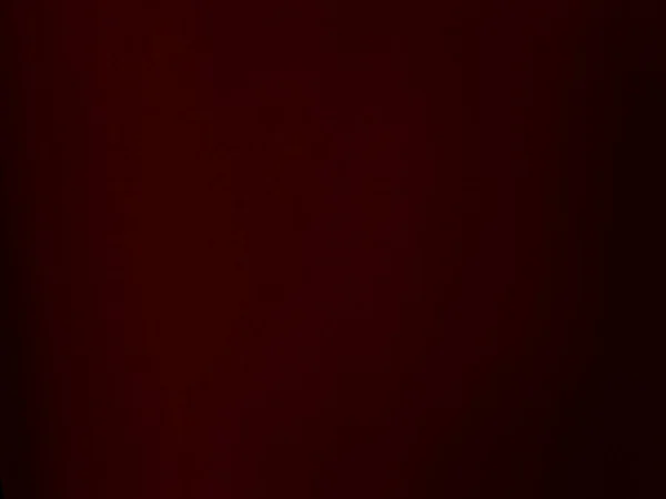 Dark red velvet fabric texture used as background. Empty dark red fabric background of soft and smooth textile material gradient. There is space for text.
